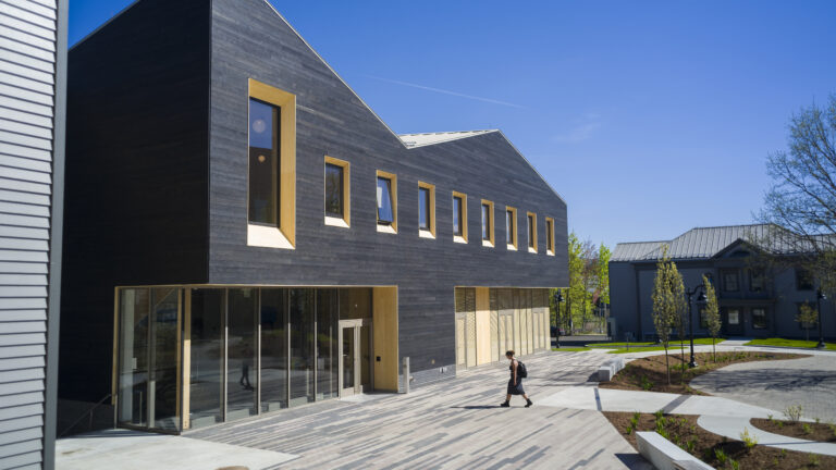 A student walking into the Davis Center