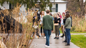 Students in a class standing outside the Class of 1966 Environmental Center