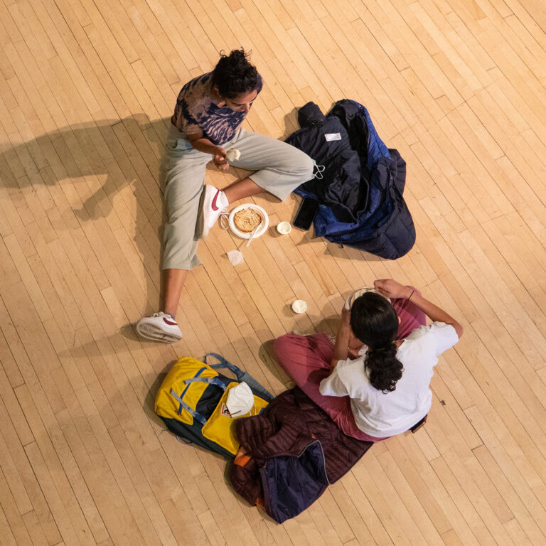 Students sitting on the floor of Goodrich