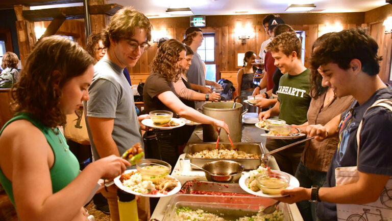 Students taking food at a Log Lunch