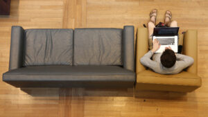 Student sitting on a sofa while studying