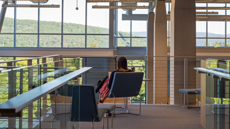 A student studying in Sawyer Library