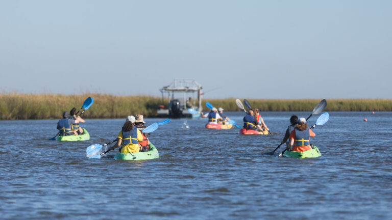 Students kayaking during the CaOS Climate and Community Leaders program