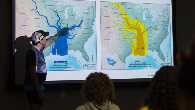 Students learning from a community leader during the CaOS Climate and Community Leaders program