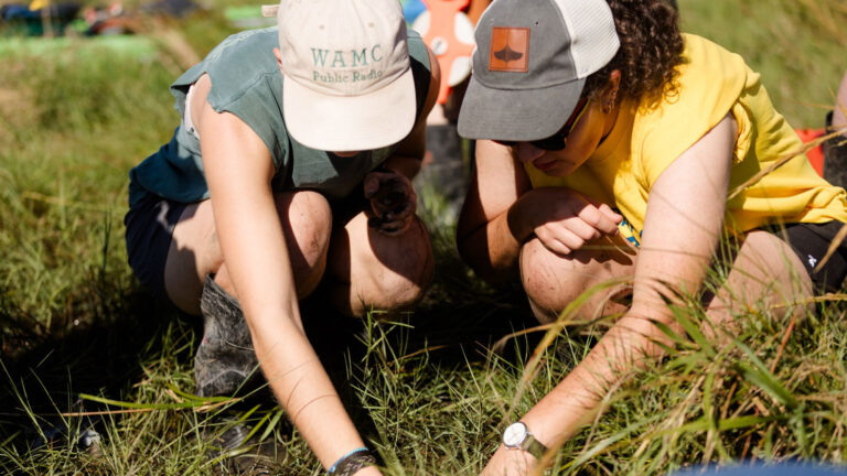 Students doing research in the field during the CaOS Climate and Community Leaders program