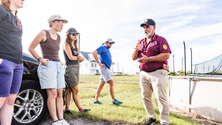 Students learning from a community leader during the CaOS Climate and Community Leaders program