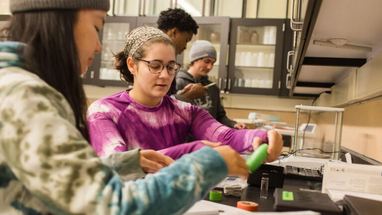 Students working in a lab during the Caos Climate and Community Leaders program