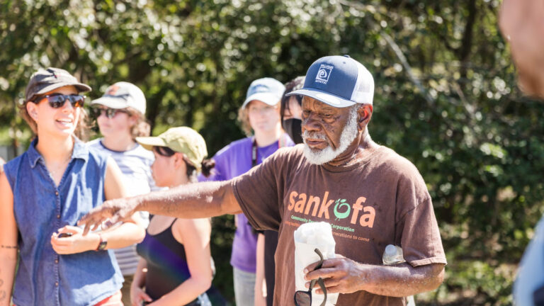 A community leader teaching students during the CaOS Climate and Community Leaders program