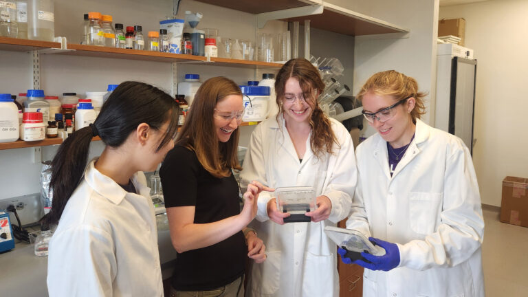 Students with Professor Cynthia Holland in the lab