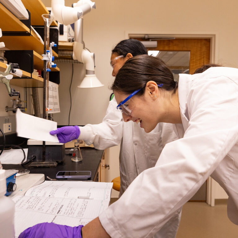 Two students working in a lab