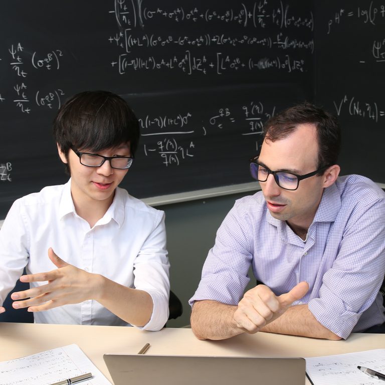 Professor Greg Phelan working with a student