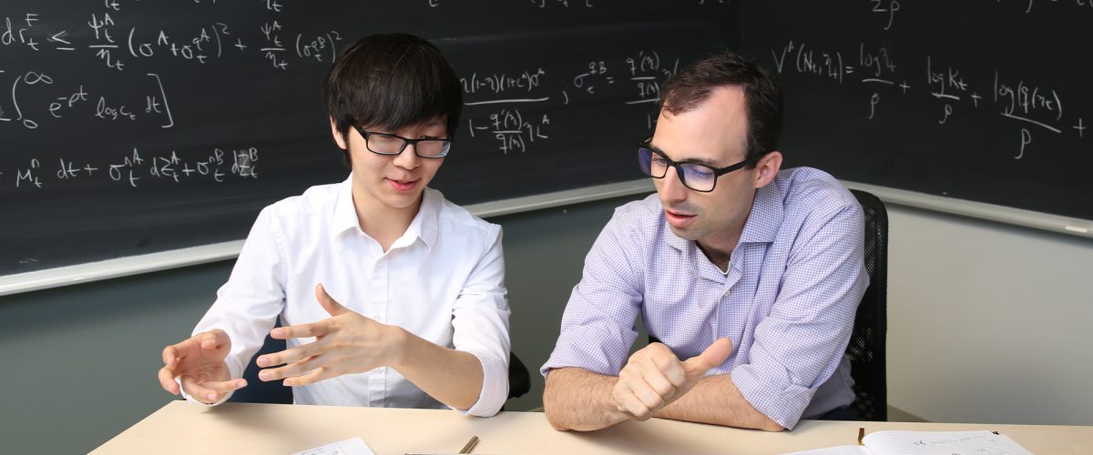 Professor Greg Phelan working with a student