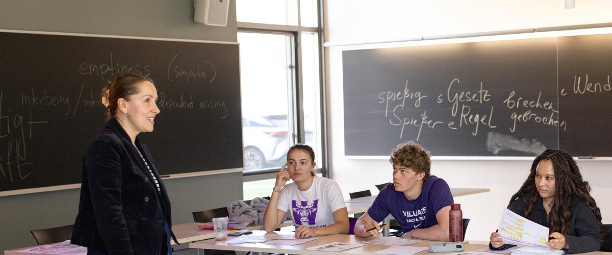 A German professor leading students in a classroom