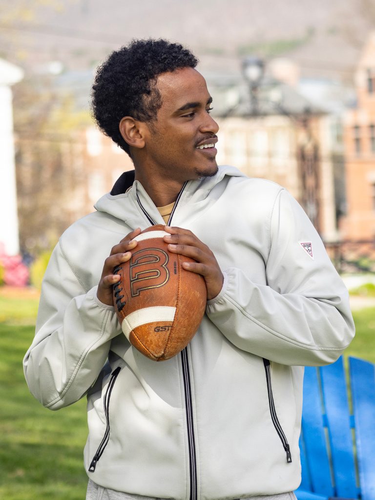 student about to throw a football