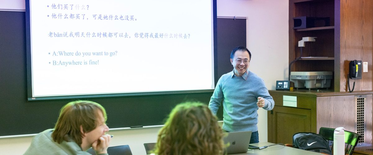 A professor leading students in a Chinese class