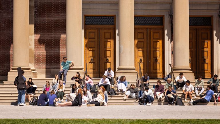 students sit on the steps of chapin hall
