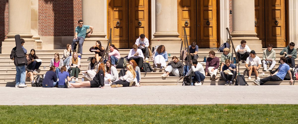 students sit on the steps of chapin hall