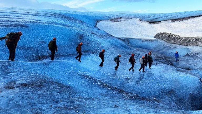 Students trek across a glacier in Iceland