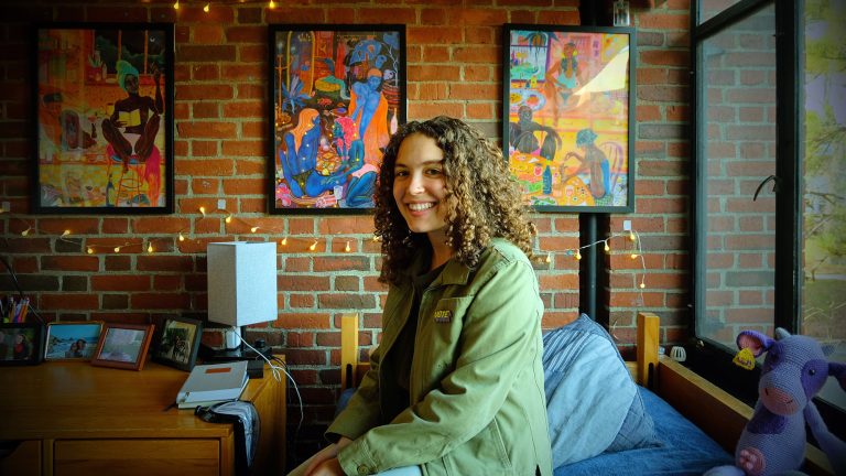 A student sitting in her dorm room