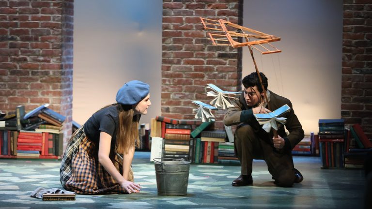 Student performers acting in the production of Into The Woods