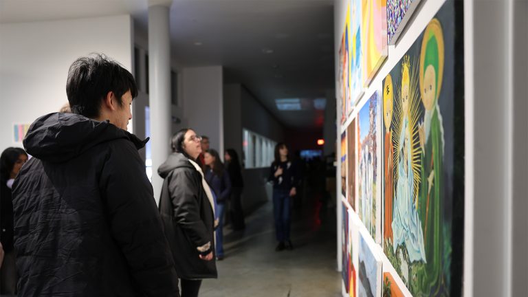 A group of students looking at art at the Big Art Show
