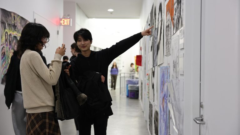 Two students looking at art at the Big Art Show