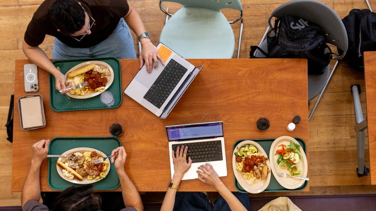 A top-down shot of students eating lunch in Paresky