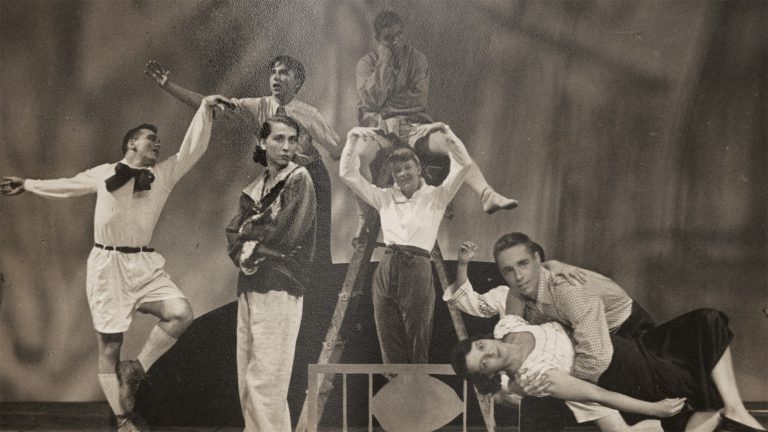 archival photo of students in costumes in theatrical poses